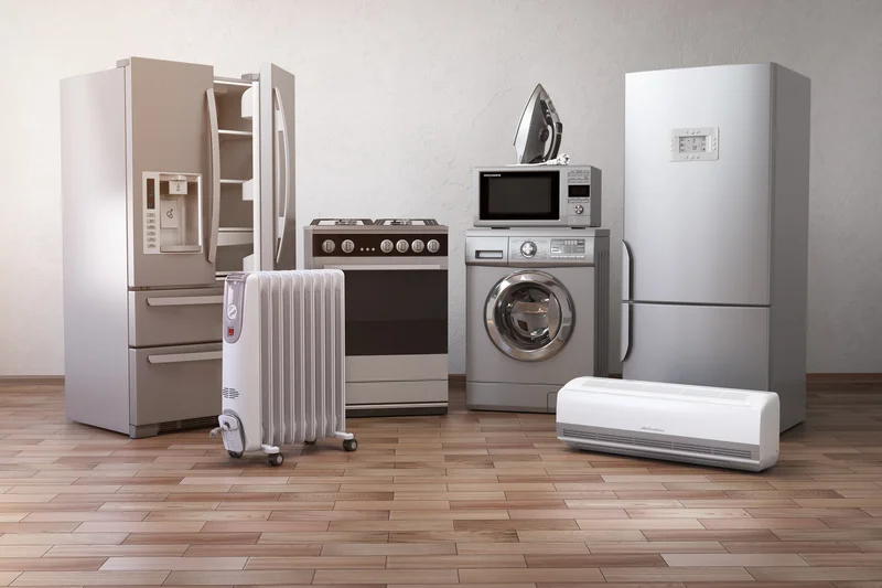 Modern home appliances including refrigerator, washing machine and stove.