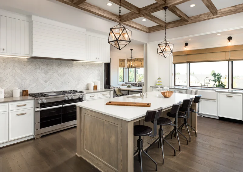 Spacious rustic modern kitchen design with wood beam ceiling and large island Spacious rustic modern kitchen design with wood beam ceiling and large island